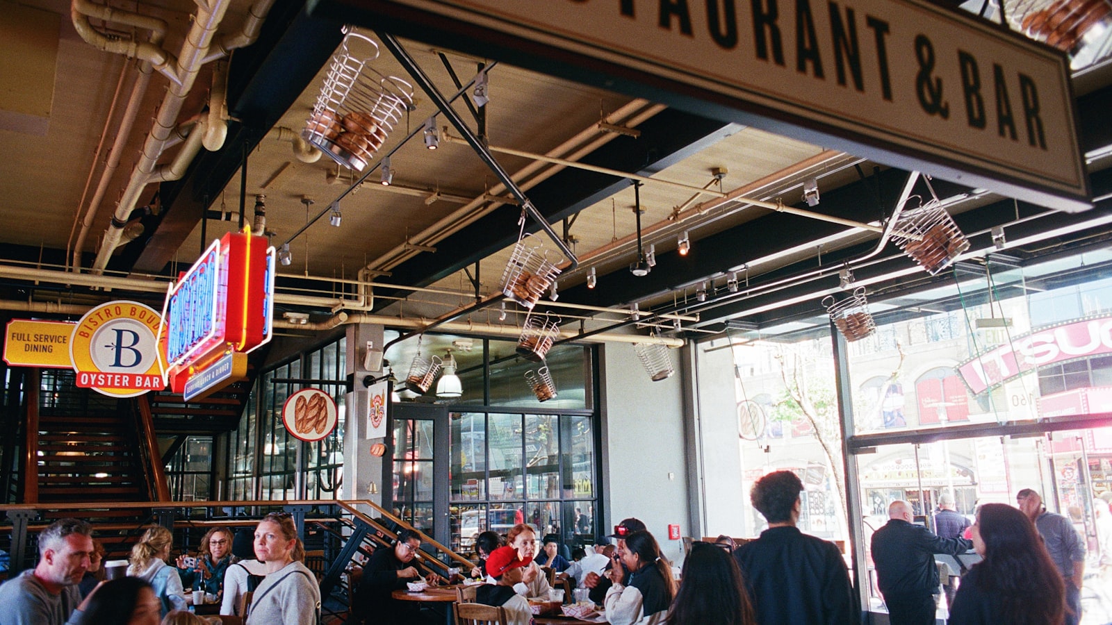 A full, lively restaurant dining room during dinner service — growing sales from the guests already walking in